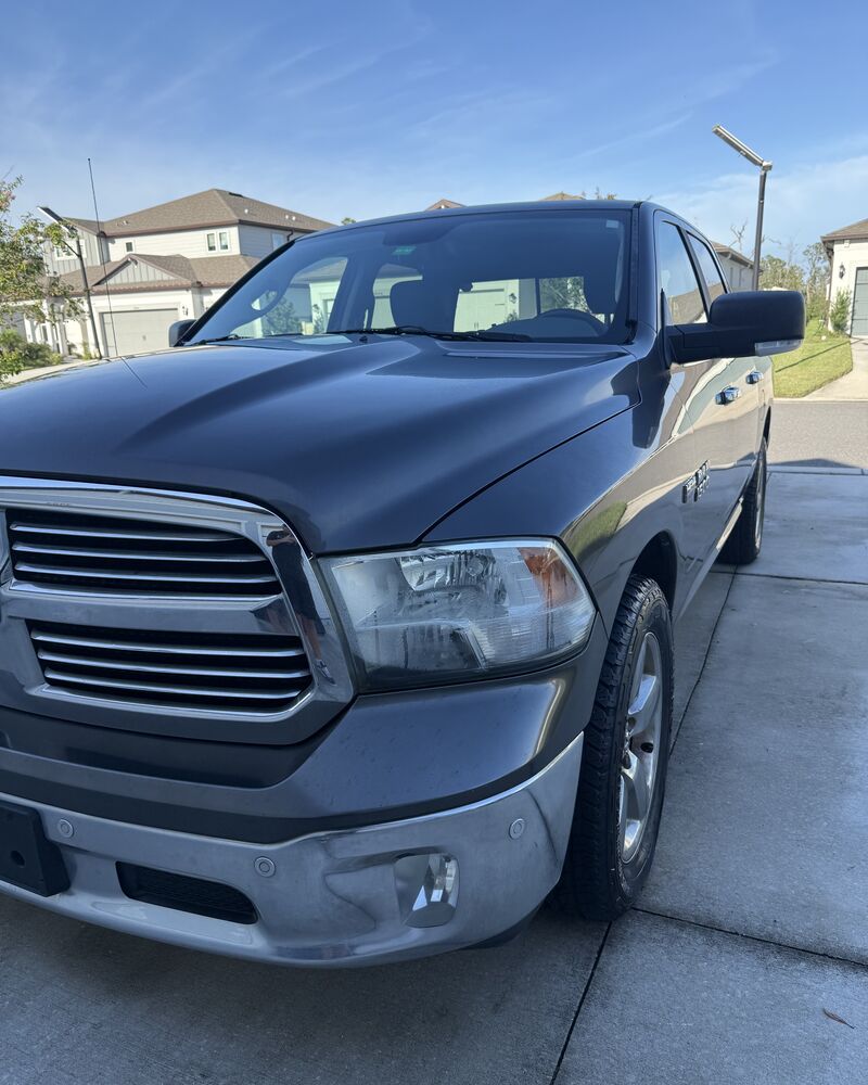 Dark gray Ram 1500 front corner polished after detailing