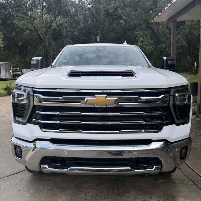 White Silverado front end after detailing