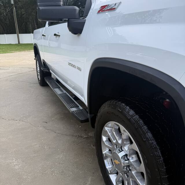 Clean Silverado running boards and tires after detailing