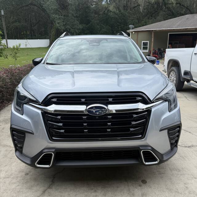 Silver Subaru SUV front end after detailing